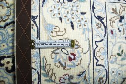 Backside of handmade New Nain rug showing knot structure and weave density