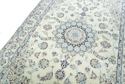 Backside of handmade New Nain rug showing knot structure and weave density