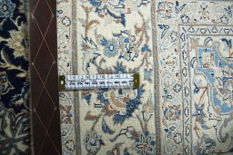Backside of handmade 1970s Nain rug showing knot structure and weave density