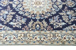 Corner detail of 2000s Nain rug showing border pattern and Wool pile