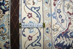 Backside of handmade 2000s Nain rug showing knot structure and weave density