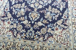 Close-up detail of 2000s Nain rug from Iran / Persia showing Wool weave