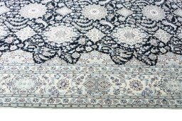 Corner detail of New Nain rug showing border pattern and Cork pile