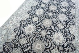 Backside of handmade New Nain rug showing knot structure and weave density