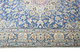 Corner detail of 2000s Nain rug showing border pattern and Wool pile