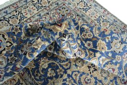 Surface texture of 2000s Nain rug with natural Wool and intricate pattern