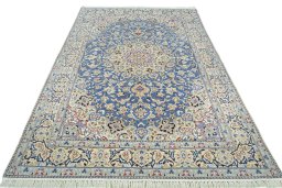 Surface texture of 2000s Nain rug with natural Wool and intricate pattern