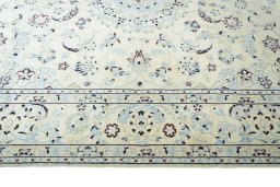 Corner detail of New Nain rug showing border pattern and Wool pile