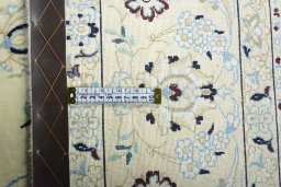 Backside of handmade New Nain rug showing knot structure and weave density
