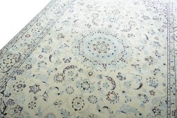 Backside of handmade New Nain rug showing knot structure and weave density