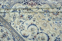 Close-up detail of 2000s Nain rug from Iran / Persia showing Wool weave