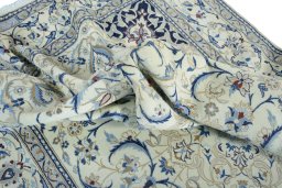 Surface texture of 2000s Nain rug with natural Wool and intricate pattern