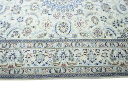 Corner detail of 2000s Nain rug showing border pattern and Wool pile