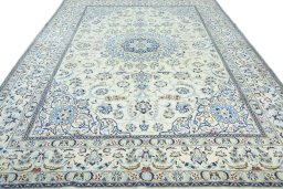Surface texture of 2000s Nain rug with natural Wool and intricate pattern