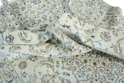 Surface texture of 2000s Nain rug with natural Wool and intricate pattern