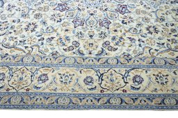 Corner detail of 2000s Nain rug showing border pattern and Wool pile