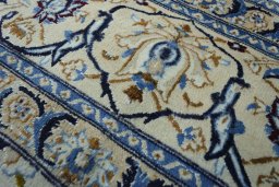 Close-up detail of 2000s Nain rug from Iran / Persia showing Wool weave