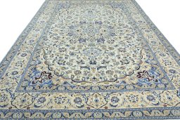 Surface texture of 2000s Nain rug with natural Wool and intricate pattern