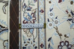 Backside of handmade New Nain rug showing knot structure and weave density