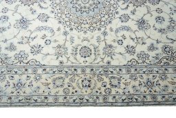 Corner detail of New Nain rug showing border pattern and Cork pile