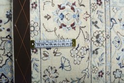 Backside of handmade New Nain rug showing knot structure and weave density