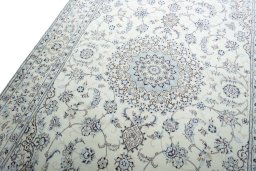 Backside of handmade New Nain rug showing knot structure and weave density