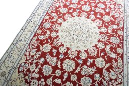 Backside of handmade New Nain rug showing knot structure and weave density