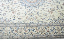 Corner detail of 2000s Nain rug showing border pattern and Cork pile