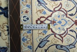 Backside of handmade New Nain rug showing knot structure and weave density