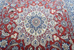 Central medallion detail of 2000s Nain rug from Iran / Persia