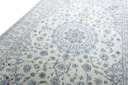 Backside of handmade New Nain rug showing knot structure and weave density