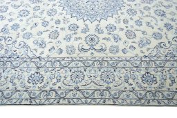 Corner detail of New Nain rug showing border pattern and Wool pile