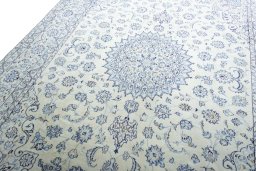 Backside of handmade New Nain rug showing knot structure and weave density