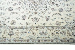 Corner detail of 2000s Nain rug showing border pattern and Wool pile