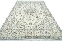 Surface texture of 2000s Nain rug with natural Wool and intricate pattern