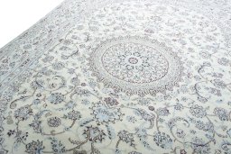 Backside of handmade New Nain rug showing knot structure and weave density
