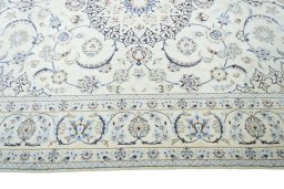 Corner detail of 2000s Nain rug showing border pattern and Wool pile