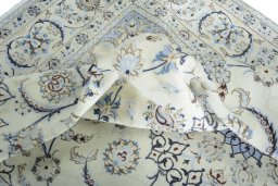 Surface texture of 2000s Nain rug with natural Wool and intricate pattern