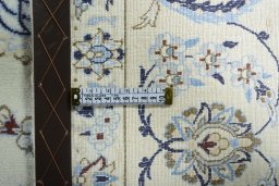 Backside of handmade 2000s Nain rug showing knot structure and weave density