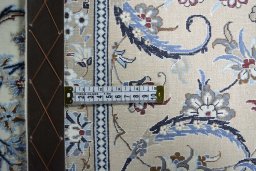 Backside of handmade New Nain rug showing knot structure and weave density