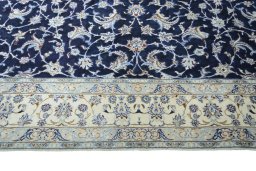Corner detail of 2000s Nain rug showing border pattern and Wool pile