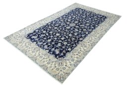 Corner detail of 2000s Nain rug showing border pattern and Wool pile