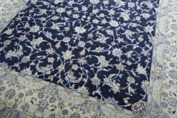 Close-up detail of 2000s Nain rug from Iran / Persia showing Wool weave