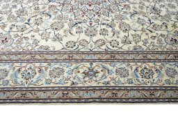 Corner detail of 2000s Nain rug showing border pattern and Wool pile