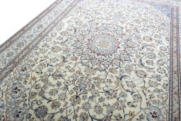 Backside of handmade 2000s Nain rug showing knot structure and weave density