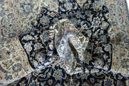 Surface texture of 1970s Nain rug with natural Cork and intricate pattern