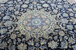 Central medallion detail of 1970s Nain rug from Iran / Persia