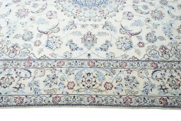 Corner detail of 2000s Nain rug showing border pattern and Wool pile