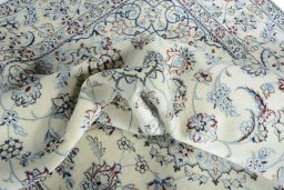 Surface texture of 2000s Nain rug with natural Wool and intricate pattern
