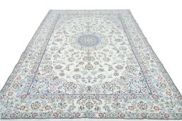 Surface texture of 2000s Nain rug with natural Wool and intricate pattern